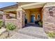 Inviting front entrance with stone accents and well-maintained landscaping at 5635 Mesa Mountain Dr, Las Vegas, NV 89135