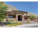 Charming home features desert landscaping and a mountain backdrop, complemented by a paver driveway at 5635 Mesa Mountain Dr, Las Vegas, NV 89135