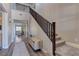 Bright foyer with wood floors, and a staircase, leading into the living space beyond at 5635 Mesa Mountain Dr, Las Vegas, NV 89135