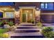 Inviting front entrance with stone pillars, manicured landscaping, and brick steps leading to the front door at 5635 Mesa Mountain Dr, Las Vegas, NV 89135