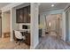 Hallway view showing a built-in desk area, wood floors and natural light at 5635 Mesa Mountain Dr, Las Vegas, NV 89135