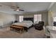 Spacious main bedroom suite with a ceiling fan, lots of room, and comfortable sitting area at 5635 Mesa Mountain Dr, Las Vegas, NV 89135