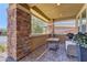 Cozy covered patio featuring a stone column and paver floor perfect for outdoor living at 5635 Mesa Mountain Dr, Las Vegas, NV 89135