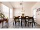 Bright dining area with large windows and stylish furnishings at 5824 Kane Holly St, Las Vegas, NV 89130