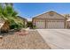 Well-kept single-story home with desert landscaping and a spacious two-car garage at 5824 Kane Holly St, Las Vegas, NV 89130
