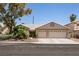 Charming single-story home featuring a two-car garage and well-maintained landscaping at 5824 Kane Holly St, Las Vegas, NV 89130