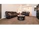 Spacious living room with comfortable seating and a coffee table at 5824 Kane Holly St, Las Vegas, NV 89130