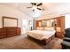 This main bedroom has a built-in headboard with mirror and lots of drawers for storage at 5824 Kane Holly St, Las Vegas, NV 89130