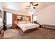 Spacious main bedroom featuring a built-in headboard with ample storage and a ceiling fan at 5824 Kane Holly St, Las Vegas, NV 89130