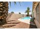 Refreshing pool framed by a palm tree and desert landscaping offering a private backyard oasis at 5824 Kane Holly St, Las Vegas, NV 89130