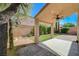 Charming backyard patio with a covered area, brick-paved sections, and lush landscaping, perfect for outdoor relaxation at 5931 Allanche Ave, Las Vegas, NV 89141