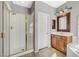 Bathroom featuring a glass-enclosed shower, vanity, and ample natural light, creating a functional space at 5931 Allanche Ave, Las Vegas, NV 89141