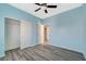 Bedroom showcasing the closet, fresh paint, and light-colored modern flooring at 5931 Allanche Ave, Las Vegas, NV 89141