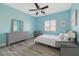 Comfortable staged bedroom with furniture and light-colored walls, showcasing a relaxing atmosphere at 5931 Allanche Ave, Las Vegas, NV 89141