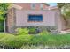 View of the Caparola community sign amidst lush landscaping, flowers and manicured hedges at 5931 Allanche Ave, Las Vegas, NV 89141