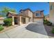 Beautiful two-story home featuring a covered porch, tiled roof, and an attached two-car garage at 5931 Allanche Ave, Las Vegas, NV 89141