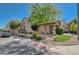 Exterior elevation of home with desert landscaping, driveway, and attractive curb appeal at 5931 Allanche Ave, Las Vegas, NV 89141