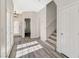 Bright and open foyer features wood floors, white trim, and a view of the staircase at 5931 Allanche Ave, Las Vegas, NV 89141