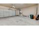 Spacious garage with roll up garage door and plenty of space for storage at 5931 Allanche Ave, Las Vegas, NV 89141