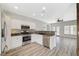 Stylish kitchen with stainless steel appliances, granite countertops, and sleek white cabinetry at 5931 Allanche Ave, Las Vegas, NV 89141