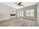 Bright living room features a modern electric fireplace, neutral paint and French doors at 5931 Allanche Ave, Las Vegas, NV 89141