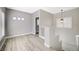 Open loft area with wood-look flooring, natural light, and neutral paint, great for a flexible space at 5931 Allanche Ave, Las Vegas, NV 89141