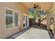 Covered patio area showing ceiling fan, concrete, brick pavers and access door to house at 5931 Allanche Ave, Las Vegas, NV 89141