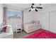 Bright bedroom with white walls, pink accents, and a large window, perfect for a retreat at 600 Beresford Ave, Las Vegas, NV 89123
