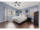 Serene bedroom with hardwood floors, neutral colors, and ample natural light at 600 Beresford Ave, Las Vegas, NV 89123