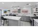 Open kitchen with an island, gray cabinets and stainless steel appliances at 600 Beresford Ave, Las Vegas, NV 89123