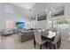 Bright open-concept living and dining area, featuring comfortable seating and a dining table at 600 Beresford Ave, Las Vegas, NV 89123