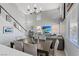 Bright open-concept living and dining area, featuring comfortable seating and a dining table at 600 Beresford Ave, Las Vegas, NV 89123