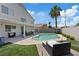 An inviting pool, a covered patio for relaxing, and green turf make this backyard perfect for enjoying outdoors at 600 Beresford Ave, Las Vegas, NV 89123