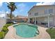 Inviting backyard pool with a covered patio, lounge seating, and well-manicured landscaping at 600 Beresford Ave, Las Vegas, NV 89123