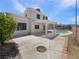 Spacious backyard with a covered patio, pool, and privacy wall, perfect for entertaining at 6120 Desert Haven Rd, Las Vegas, NV 89130