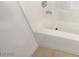 Close up view of a white tub and tile at 6120 Desert Haven Rd, Las Vegas, NV 89130
