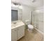 Bathroom featuring a single vanity, toilet, and a shower with sliding glass doors at 6120 Desert Haven Rd, Las Vegas, NV 89130