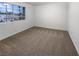 Neutral bedroom featuring carpet and a window at 6120 Desert Haven Rd, Las Vegas, NV 89130