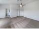 Spacious bedroom featuring neutral carpeting, a ceiling fan, and ample natural light at 6120 Desert Haven Rd, Las Vegas, NV 89130
