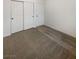 Bedroom featuring a closet with sliding doors and neutral carpeting at 6120 Desert Haven Rd, Las Vegas, NV 89130