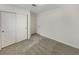 Bedroom featuring carpet flooring, a closet with sliding doors, and an entry door at 6120 Desert Haven Rd, Las Vegas, NV 89130