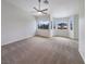 Bedroom with large windows providing natural light and a ceiling fan at 6120 Desert Haven Rd, Las Vegas, NV 89130