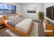 Cozy main bedroom with accent wall, modern furnishings, and lots of natural light at 6120 Desert Haven Rd, Las Vegas, NV 89130