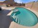 Backyard pool with a built-in hot tub and steps for easy access on a sunny day at 6120 Desert Haven Rd, Las Vegas, NV 89130