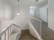 Carpeted staircase with white railings leading to the upper level of the home at 6120 Desert Haven Rd, Las Vegas, NV 89130