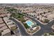Aerial view of a residential area with pool and clubhouse in the center at 6581 Netherseal Ave, Las Vegas, NV 89139