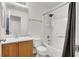 Bathroom features a vanity with sink and a shower over tub combination with white tile at 6581 Netherseal Ave, Las Vegas, NV 89139