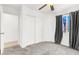 Bedroom with light gray carpet and a window with dark gray drapes at 6581 Netherseal Ave, Las Vegas, NV 89139