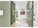 An entryway into a naturally lit home showcasing warm wooden decor at 6581 Netherseal Ave, Las Vegas, NV 89139