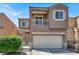 Two-story home featuring a balcony, garage, and well maintained front yard at 6581 Netherseal Ave, Las Vegas, NV 89139